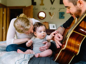 Baby listening to daddy play guitar Baby listening to daddy play guitar