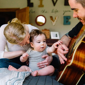Baby listening to daddy play guitar Baby listening to daddy play guitar